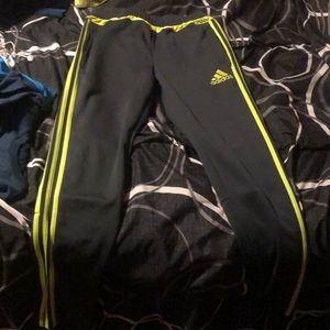 Size L for 13-14 year olds adidas official it’s gray and has light green stripes